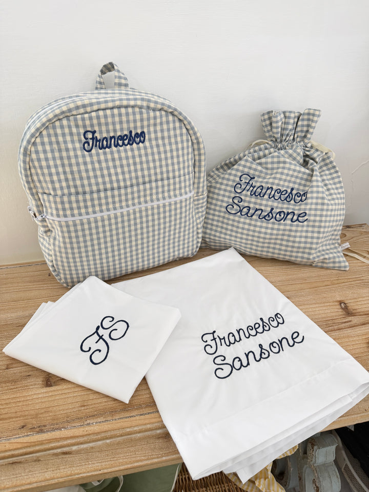 ZAINETTO CON TASCA” TESSUTO QUADRETTO”